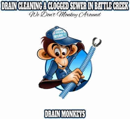 drain cleaning a clogged sewer in battle creek mi drain monkeys logo for servicing a sewer pipe